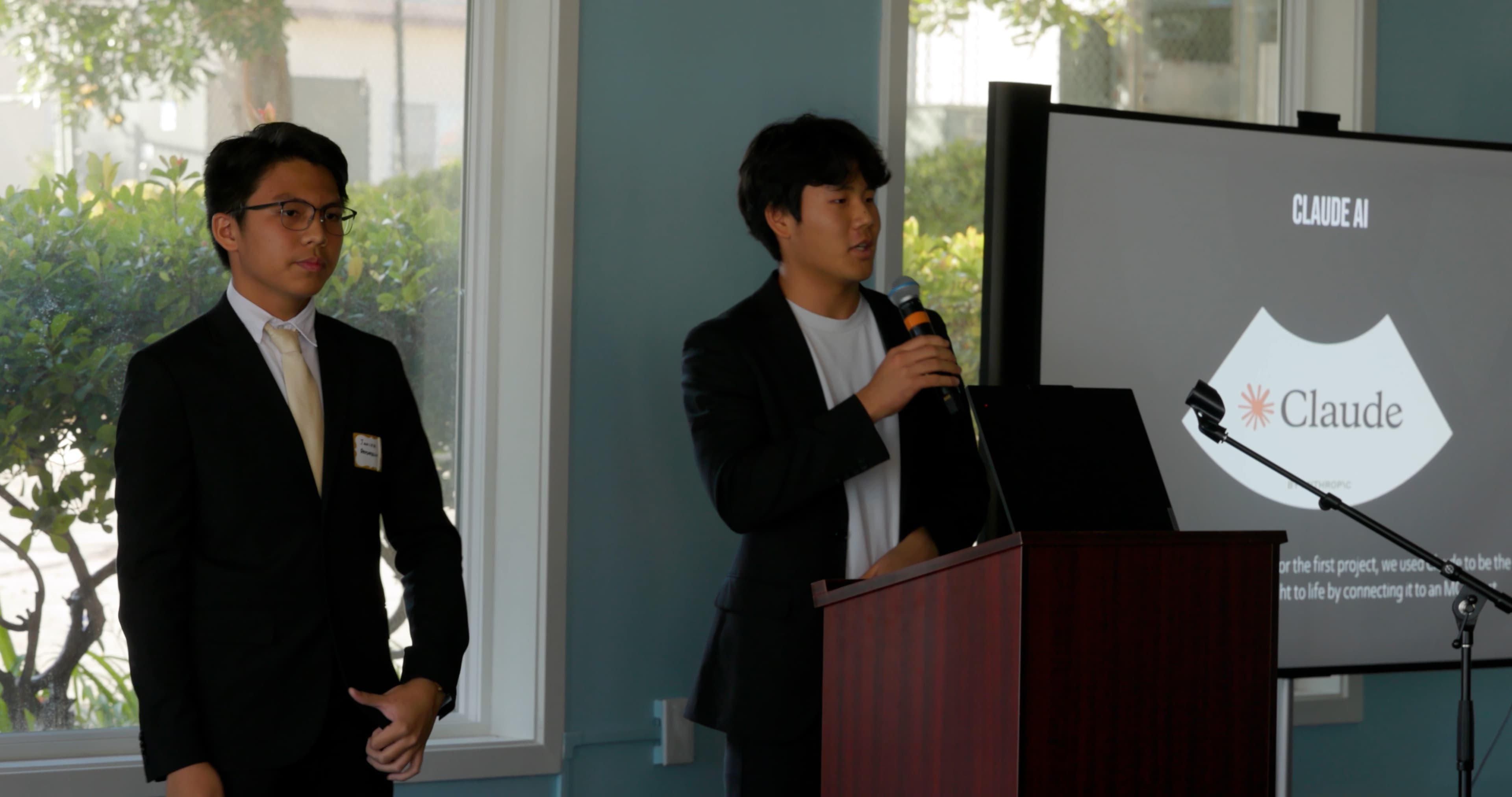 Students presenting on stage